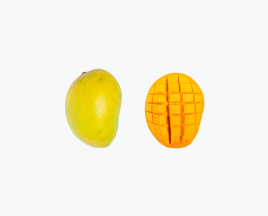 An image of two mangoes, one whole and the other cut into pieces showing the flesh and seeds. hapus mango online
